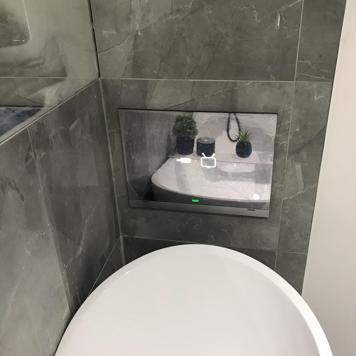 Bathroom mirror TV installation